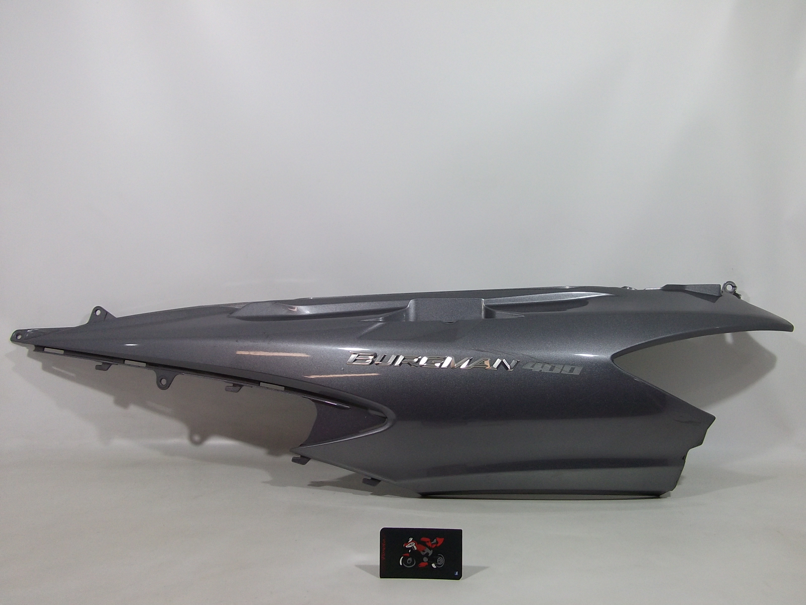 TAPA LATERAL TRASERA IZQUIERDA SUZUKI BURGMAN 400 2007