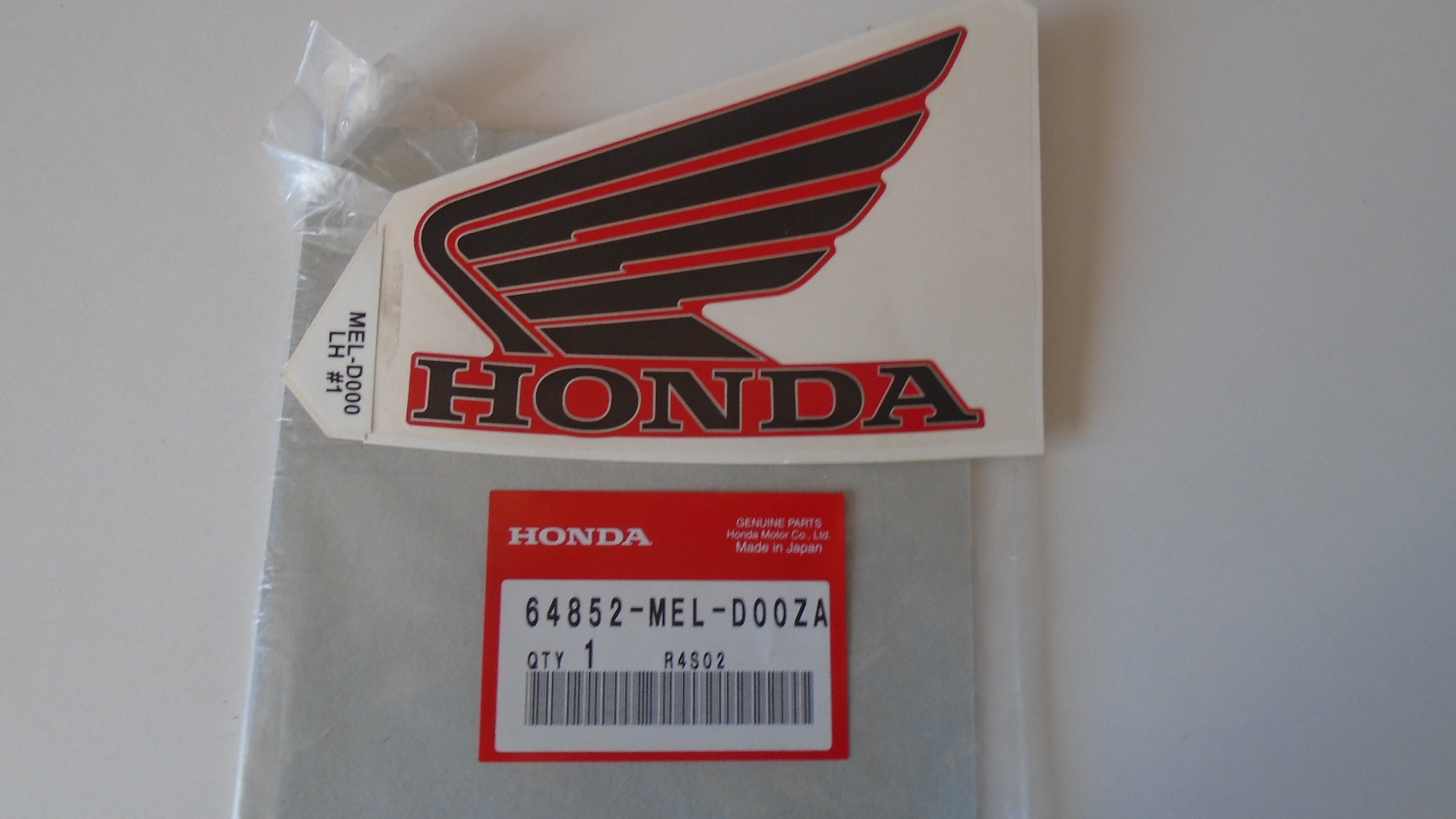 64852-MEL-D00ZA ADHESIVOS OEM HONDA.