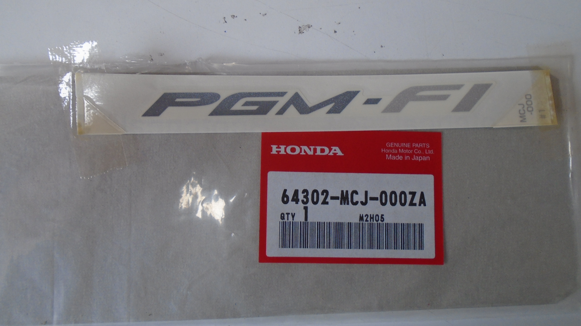 64302-MCJ-000ZA ADHESIVOS OEM HONDA.